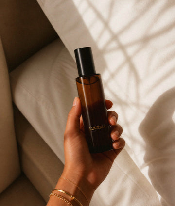 Soft earth-toned candle scene with gentle natural light — representing grounding fragrance and a calm, scent-sensitive ritual.