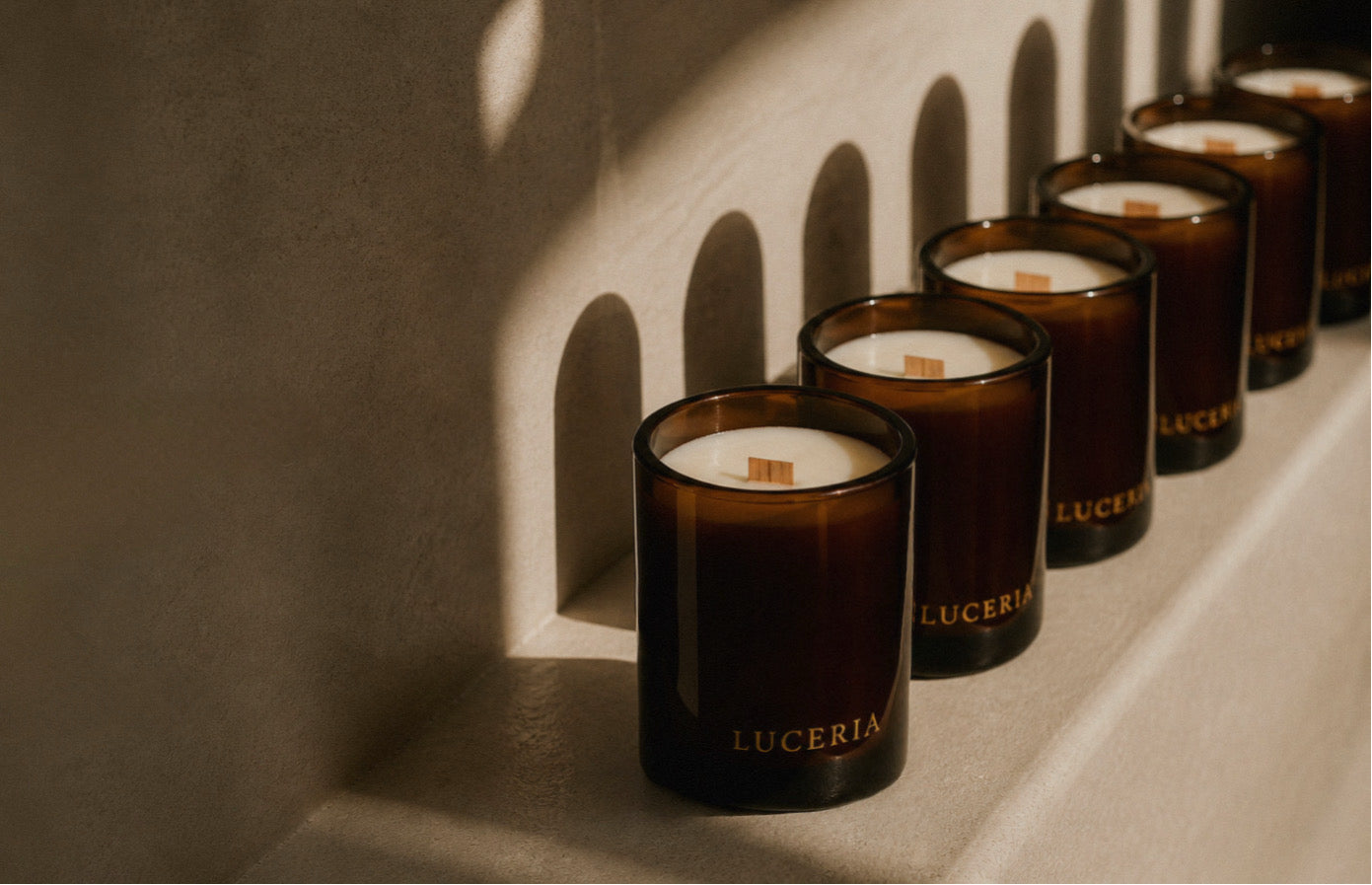 Gentle gift ideas for scent-sensitive people featuring soft candles and calming home items.