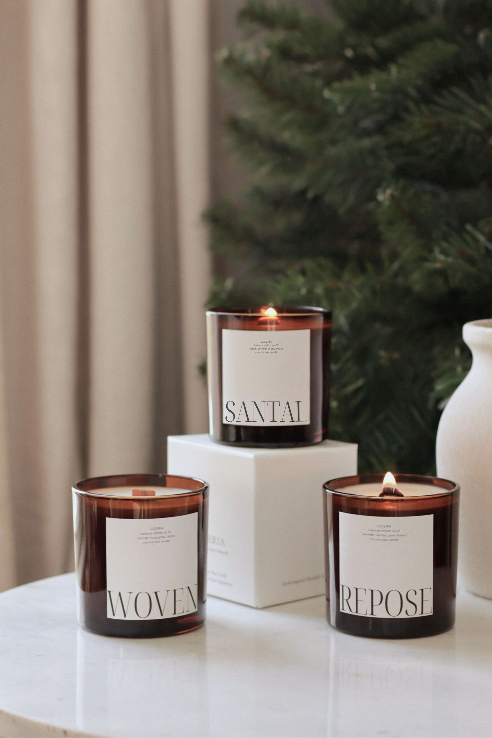 Luceria Balance Edition candles styled with warm, minimal earthy tones.
