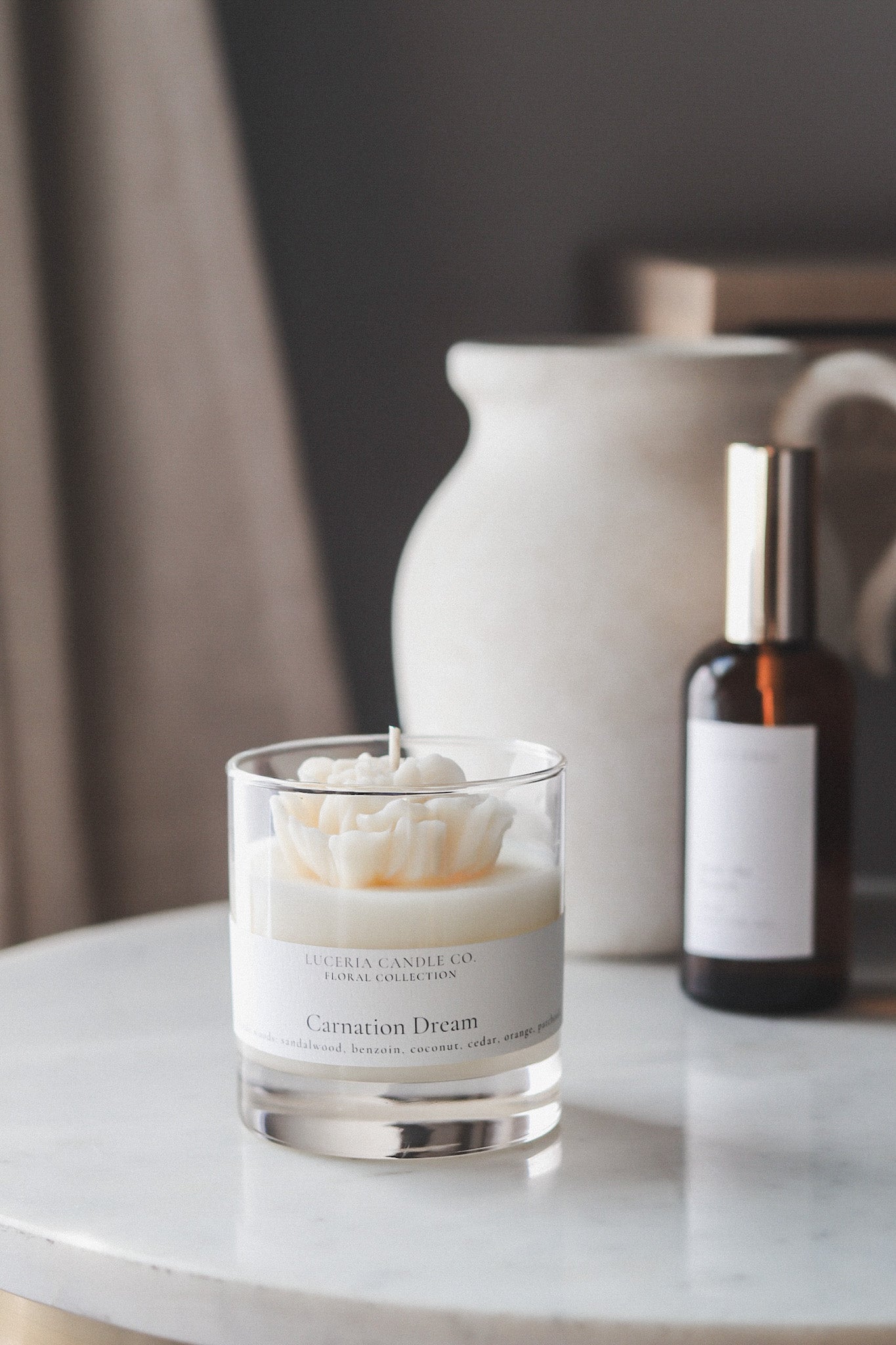 Luceria Limited Edition seasonal candle styled in warm, earthy tones.