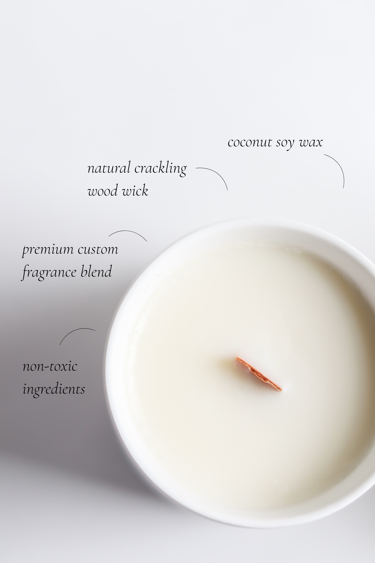 Wood wick candle with labeled ingredients on a white background