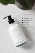 Hand lotion bottle with ingredients listed on a light background