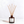 A Luceria reed diffuser with a dark amber glass bottle and natural wood reeds, featuring a white label with the brand name 'SANTAL' printed in black. The diffuser is set against a clean, light gray background with a soft shadow cast to the left.