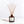 A Luceria reed diffuser bottle made of dark amber glass with a white label reading 'REPOSE' and natural wood reed sticks, set against a clean white background.
