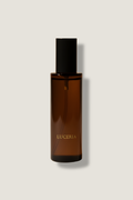 Brown spray bottle with black cap on a light gray background, featuring the brand 'LUCERIA'.
