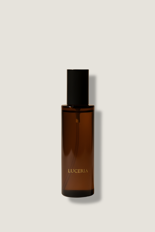 Brown bottle with black cap on a light gray background
