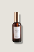 Brown bottle with a white label on a light gray background