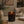 Luceria Lavender and Cedar candle in a amber glass vessel with a natural wood wick, styled in a calm neutral setting inspired by fresh linen and cedar.