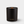 A matte black glass jar candle with a small wooden wick and gold 'LUCERIA' branding on the front, set against a light gray background.