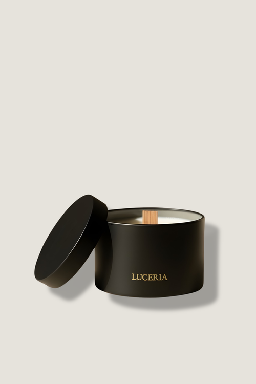 Black candle jar with lid on a light beige background, featuring the brand 'Luceria'.