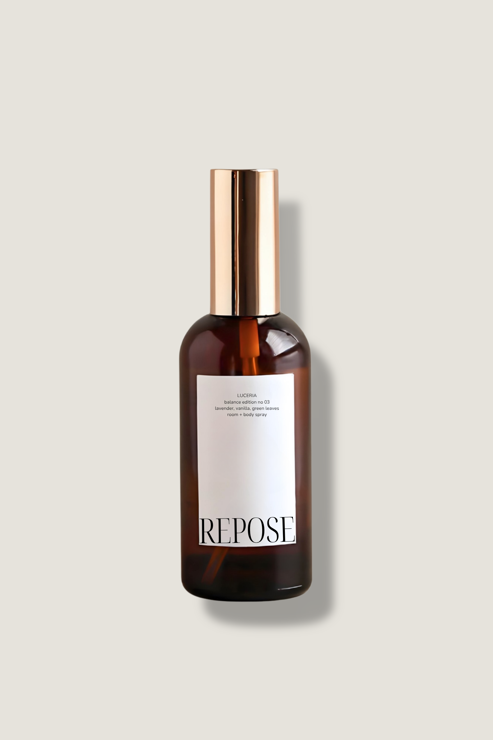 Brown bottle with gold cap labeled 'Repose' on a light gray background
