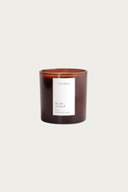 Persimmon citron scented candle with a label on a white background