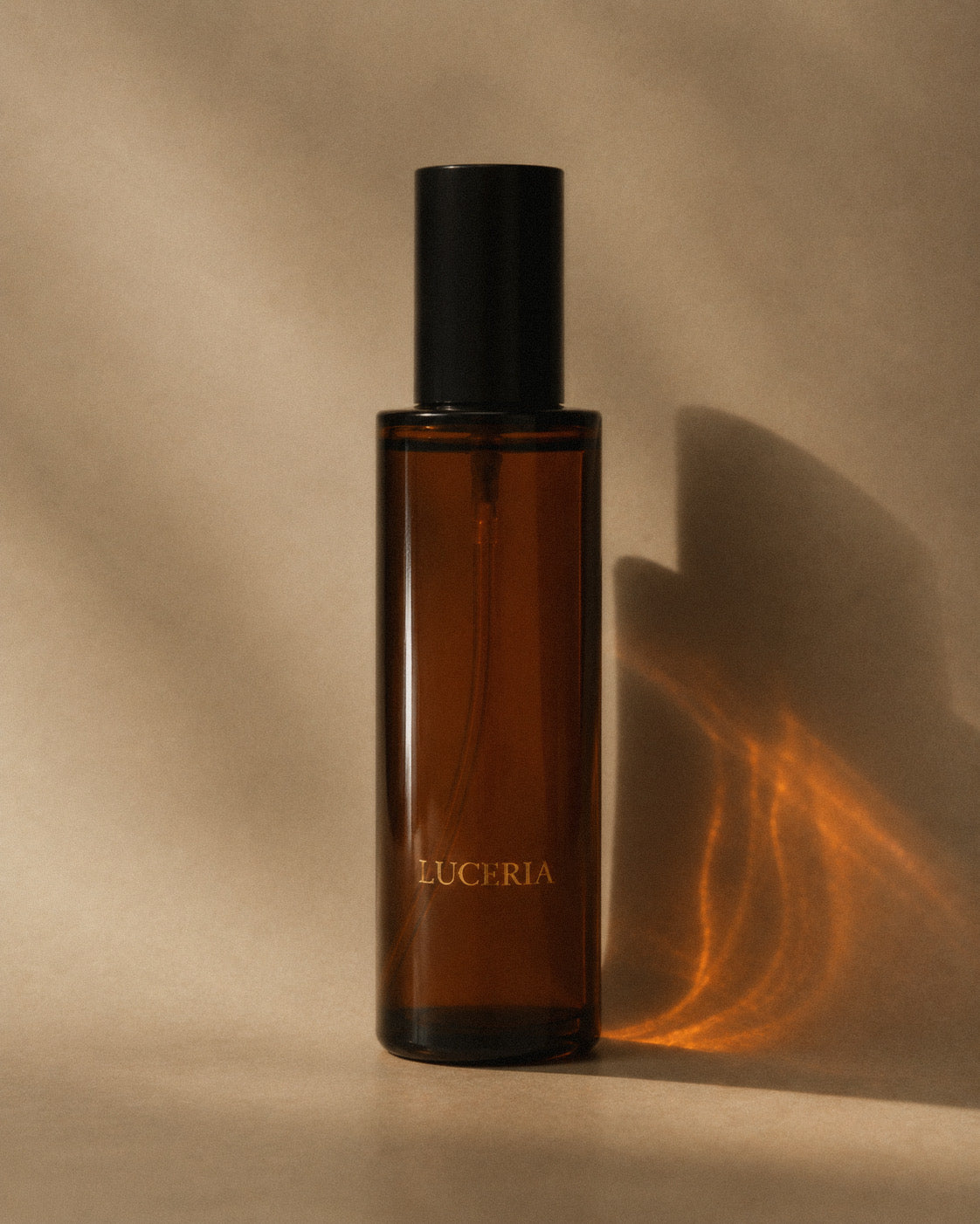 Brown Luceria bottle with black cap on a light beige background