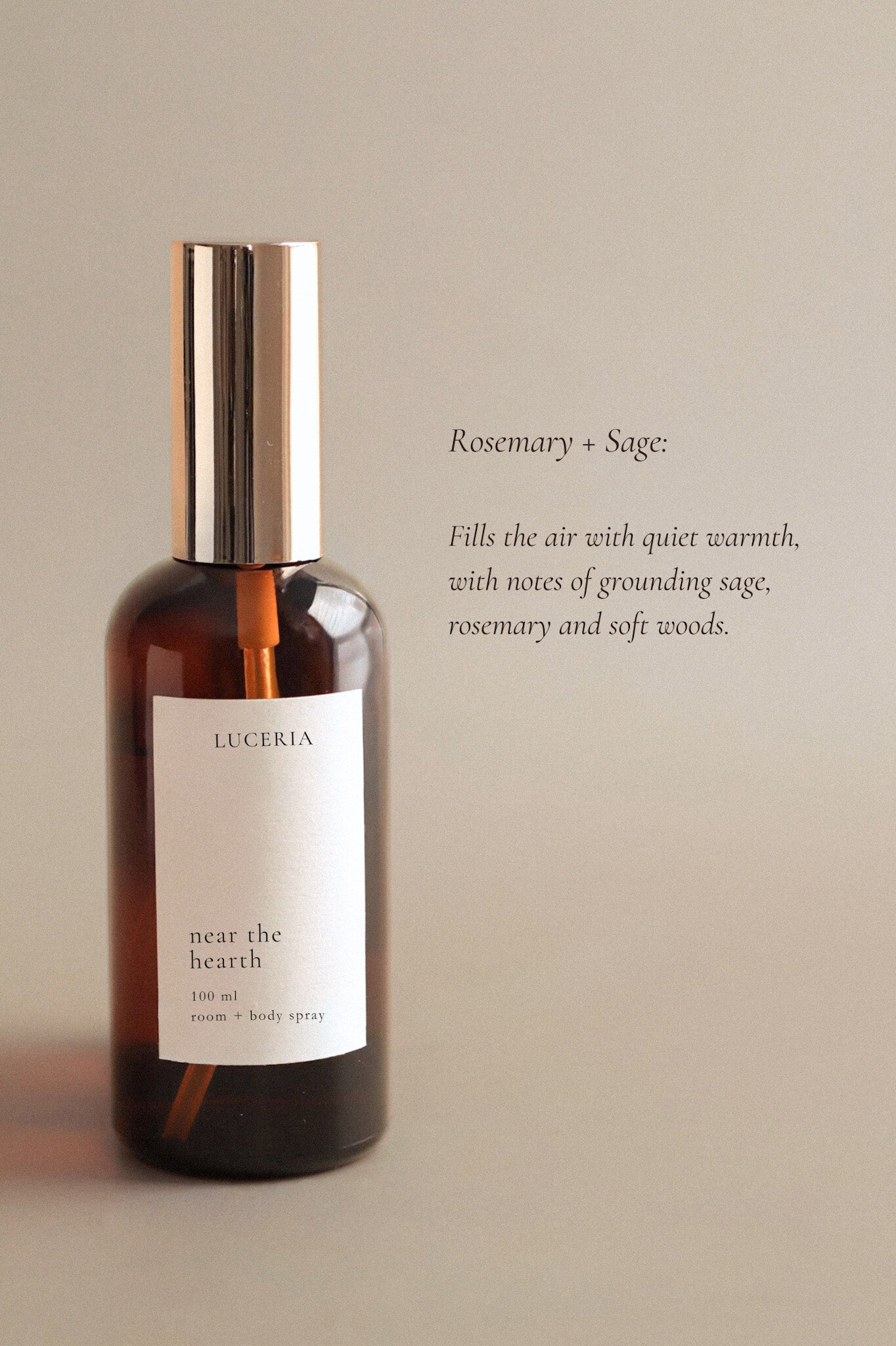 A bottle of Luceria room and body spray labeled 'near the hearth' on a beige background.