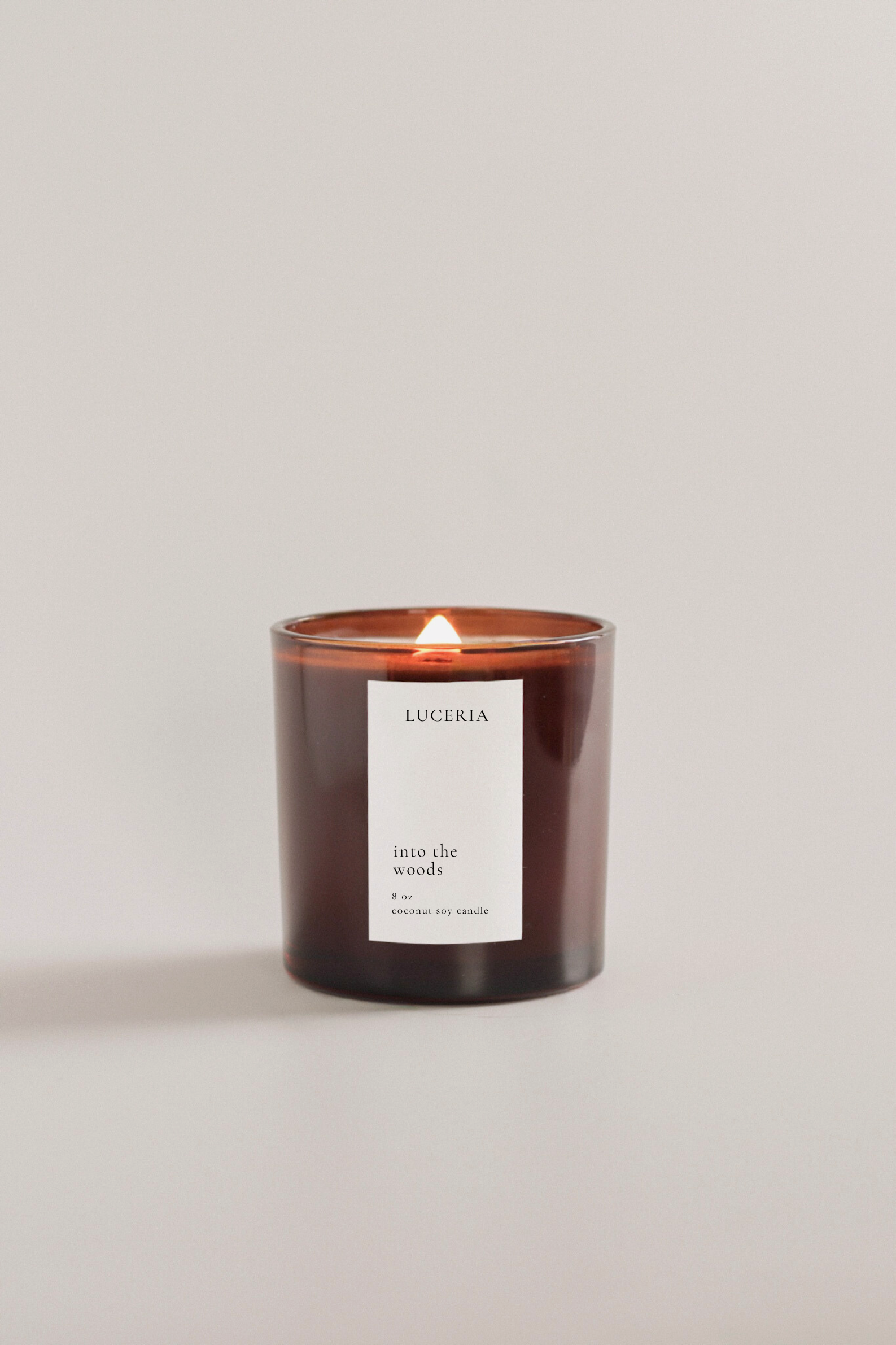 Luceria candle with a label on a light beige background