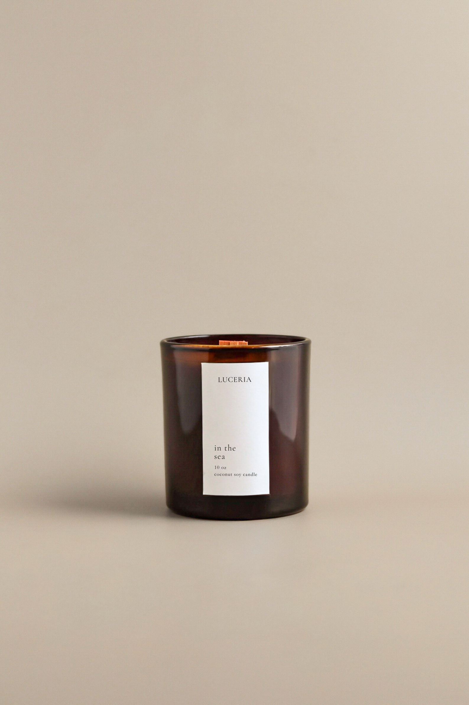 In the Sea candle with Luceria label on a beige background