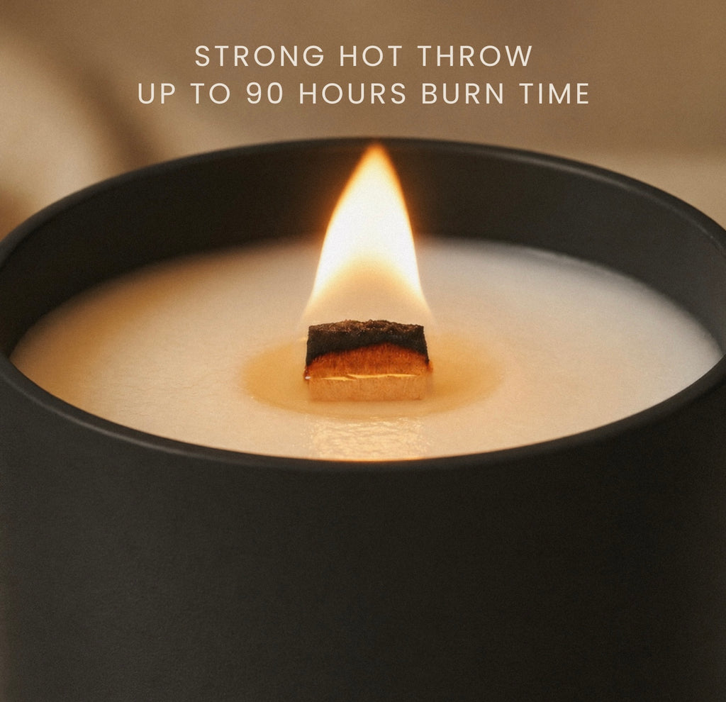 A close-up of a Luceria black candle jar with a lit wick and flame, showing cream-colored wax. Text at the top reads 'STRONG HOT THROW UP TO 90 HOURS BURN TIME'.