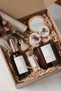 Gift set with candle products and wax melts in a curated gift box.