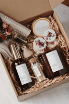 Gift set with candle products and wax melts in a curated gift box.