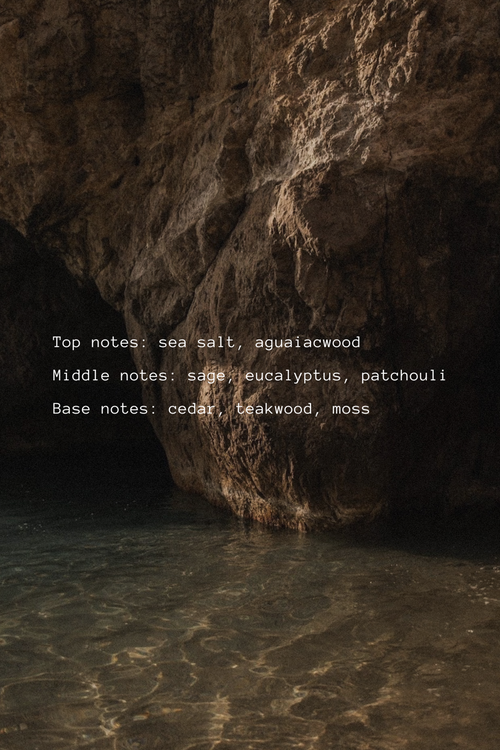 Rocks with water at the base in a dark setting