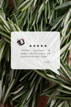 Five-star review for Near the Hearth Candle card on a background of rosemary