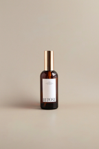 Brown bottle with gold cap on a beige background