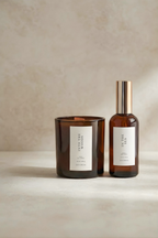 Two brown glass Luceria products with labels on a beige background, The gentle reset ritual set