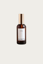 Brown bottle with gold cap on a white background, featuring the brand 'Woven'.