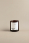Luceria's soft Eucalyptus scented candle with 'WOVEN' label on a beige background