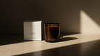 Luceria candle and packaging on a wooden surface with soft lighting