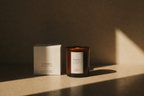 persimmon citron scented candle by luceria candle co in a neutral background with branded box