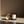 Luceria No. 03 Repose lavender and vanilla coconut soy candle with a crackling wood wick in an amber glass jar styled in warm natural light.