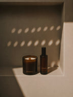 Two dark glass products with 'LUCERIA' branding on a textured surface with light patterns.