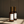 Luceria No. 02 Santal room spray in an amber glass bottle with creamy sandalwood and coconut notes styled in warm natural light.