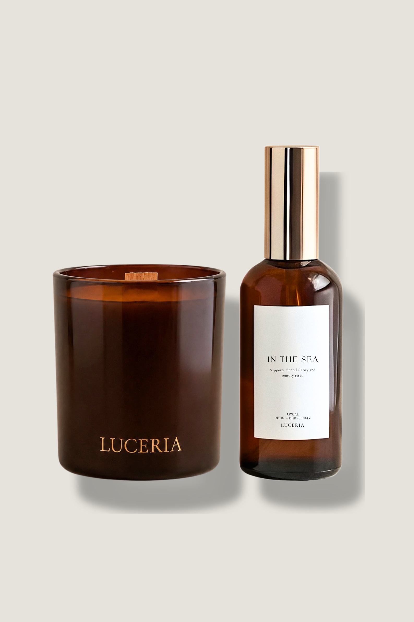 Brown candle and bottle with 'Lucerlia' branding on a light gray background