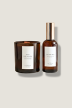 Candle and diffuser labeled 'In the Woods' and 'In the Sea' on a neutral background